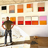 Arvid Boecker views his work in the studio